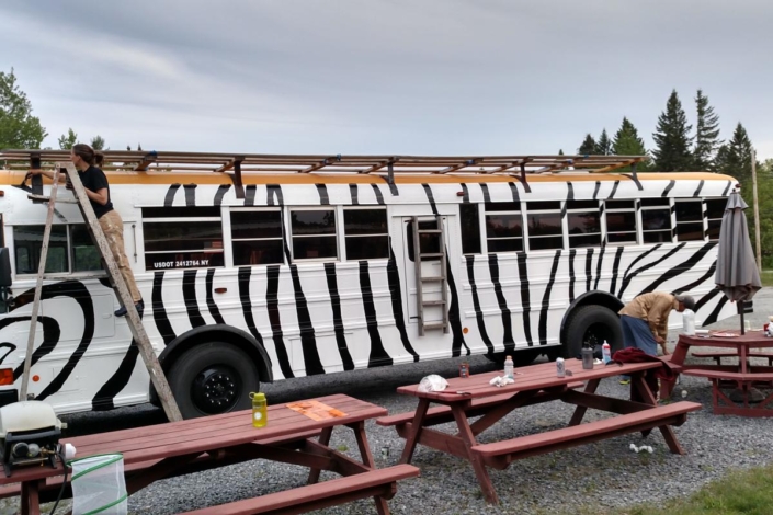 Guides paiting the Zebra bus