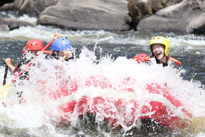 Raft splashing through a wave