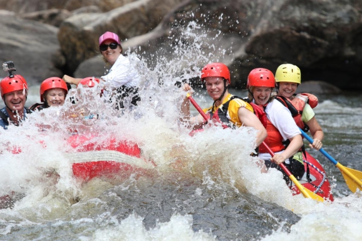 Raft hitting a big wave